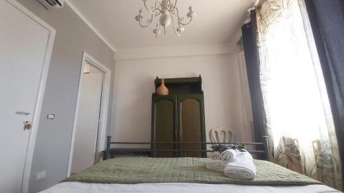 a bedroom with a bed with towels on it at Tenuta delle Acque in Acquasparta