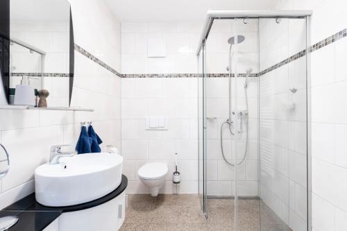 Ett badrum på Villa Nause - Meerblick & Spa