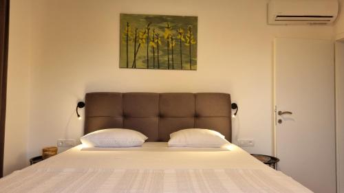Ένα ή περισσότερα κρεβάτια σε δωμάτιο στο Apartment Noel Cavtat 1