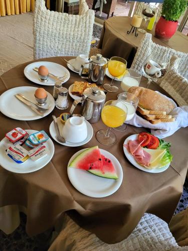 a table with plates of food on top of it at Possidon in Agia Marina Aegina