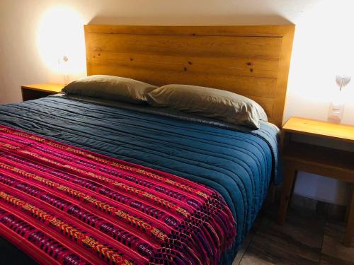 Una cama o camas en una habitación de Hotel María del Tío Molcas