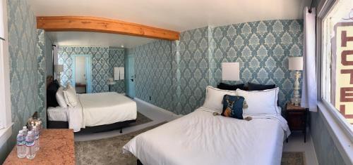 Ένα ή περισσότερα κρεβάτια σε δωμάτιο στο The Bodie Hotel