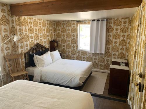 Ένα ή περισσότερα κρεβάτια σε δωμάτιο στο The Bodie Hotel