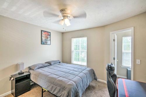 a bedroom with a bed and a ceiling fan at La Vergne Townhome 22 Mi to Dtwn Nashville! in La Vergne