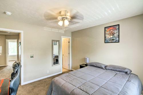 a bedroom with a bed and a ceiling fan at La Vergne Townhome 22 Mi to Dtwn Nashville! in La Vergne