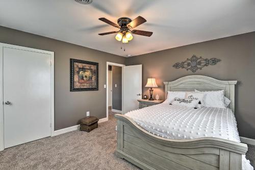 a bedroom with a bed and a ceiling fan at Bowling Green Farmhouse 10 Mi to Mammoth Cave in Smiths Grove
