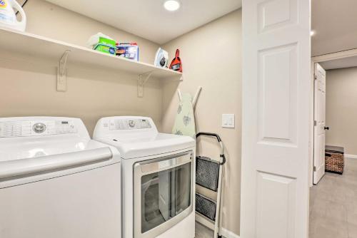 a laundry room with a washer and dryer at Tucson Getaway with Private Pool and Gas Grill! in Tucson