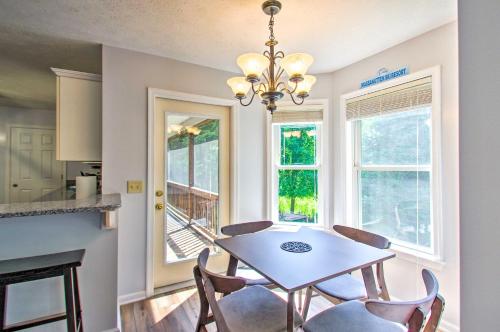 a kitchen and dining room with a table and chairs at Massanutten Family Home 13 Mi to Natl Park! in McGaheysville