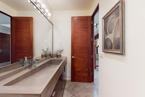 a bathroom with a double sink and a mirror at Belmont Beauty in Ketchum