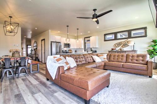 a living room with a couch and a table at Modern Bozeman Family Townhome with Hot Tub! in Bozeman