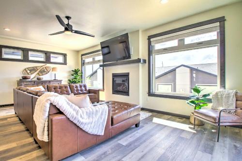 a living room with a couch and a window at Modern Bozeman Family Townhome with Hot Tub! in Bozeman