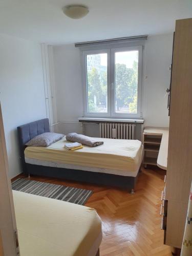Llit o llits en una habitació de Apartman M&M