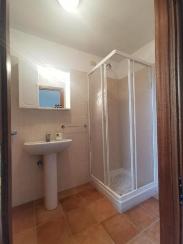 a bathroom with a shower and a sink at Fattoria della Sabatina in La Sabatina