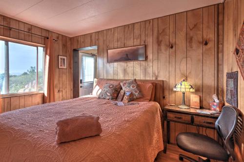a bedroom with a bed and a desk and a chair at Sedona Studio at Thunder Mountain in Sedona