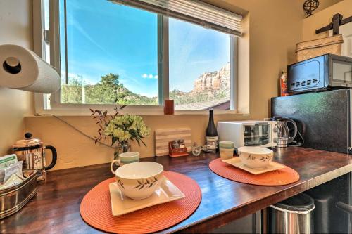 a kitchen with a counter with two plates and cups at Sedona Studio at Thunder Mountain in Sedona