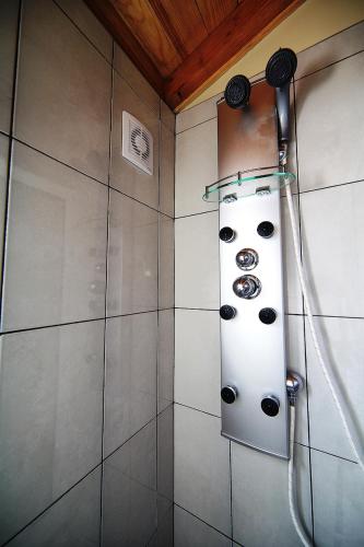 a bathroom with a shower with at Herdade do Pedregal in Ponta do Pargo