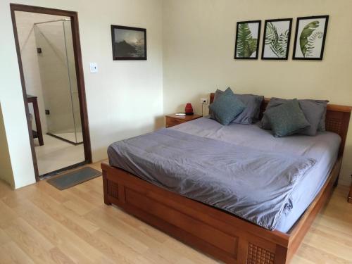 a bedroom with a bed and a mirror in it at Haven Vietnam in Quy Nhon