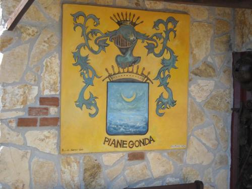 a sign on the wall of a stone wall at B&B Casabasoti in Valli del Pasubio
