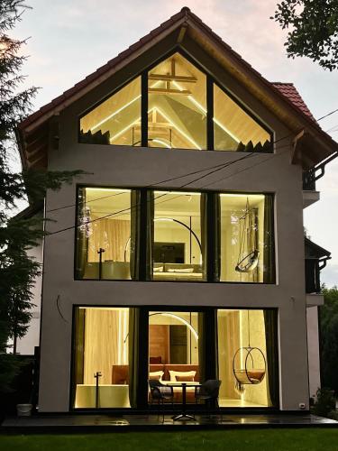 a house with large windows at Garden Retreat Junior in Bran
