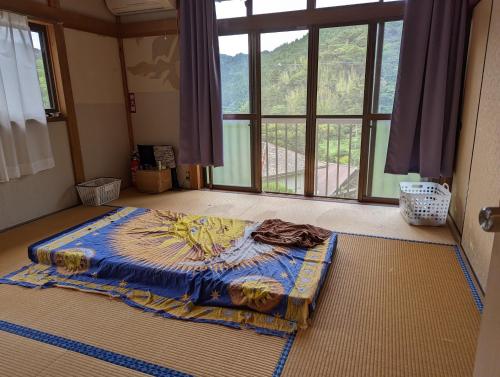 Voodi või voodid majutusasutuse Guest House 葵屋 toas