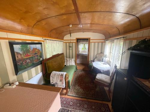 an interior view of a living room in an rv at Zirkuswagen am Landhaus Labes (Stechlinsee) in Neuglobsow
