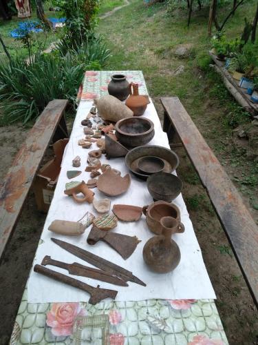 a table filled with pottery on top of it at Sim Guesthouse in Sım