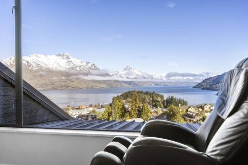 a room with a view of a lake and mountains at Awesome Studio - Amazing Mountain & Lake Views in Queenstown