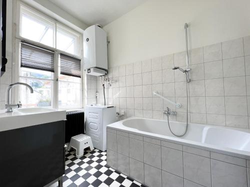 Ванна кімната в Stadtjuwel mit Pfänderblick