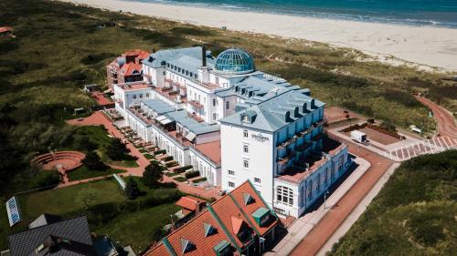 an aerial view of a hotel on the beach at Strandhotel Kurhaus Juist in Juist