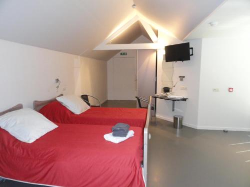 Ένα ή περισσότερα κρεβάτια σε δωμάτιο στο B&B Altijd Genieten