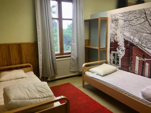 Villa Facklan tesisinde bir odada yatak veya yataklar