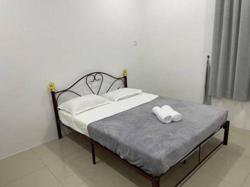 Кровать или кровати в номере Wawasan Sweet Home - UTS Sibu