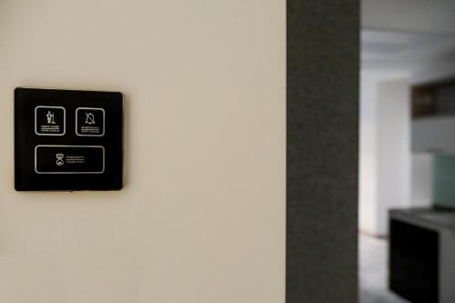 a lightswitch on a wall in a room at Rooftop Apart-Hotel in Yerevan