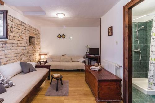 a living room with a couch and a shower at Little App - magical surrounding in Sveti Petar u Šumi