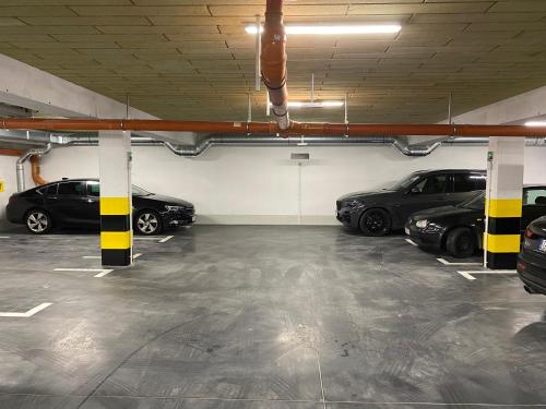 a parking garage with several cars parked in it at APARTAMENT Jola 2 in Jastrzębia Góra