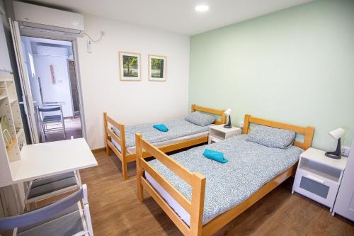 Ένα ή περισσότερα κρεβάτια σε δωμάτιο στο Urban House - Ada