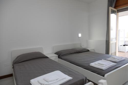 Un ou plusieurs lits dans un hébergement de l'établissement B&B Lungomare Diamante