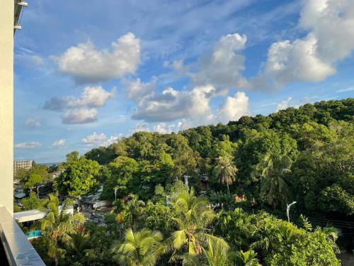 a view of a jungle with palm trees and a sky at Leaf Hotel Phu Quoc in Phu Quoc
