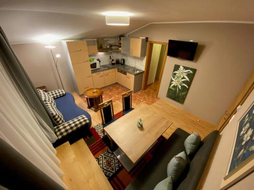 an overhead view of a living room and kitchen at Himmelsbögen und Apartments mit Seeblick und Alleinlage in Weissensee