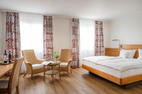 Postel nebo postele na pokoji v ubytování Ringhotel Krone