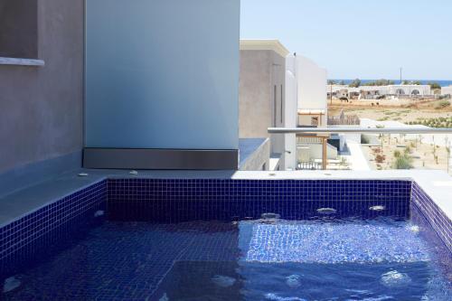 The swimming pool at or near Sea Breeze Santorini Beach Resort, Curio By Hilton