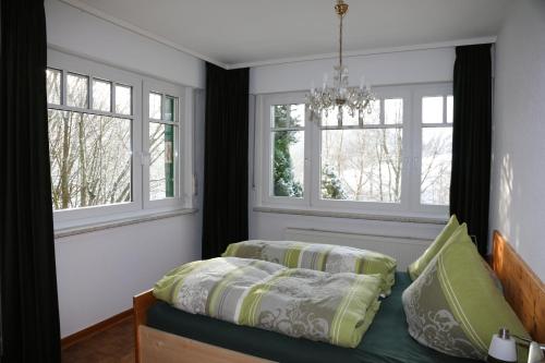 Ένα ή περισσότερα κρεβάτια σε δωμάτιο στο mal abschalten