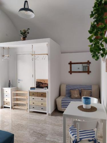 a living room with a table and a couch at Dimora del Pescatore in Manfredonia