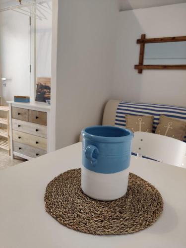 a blue and white bucket sitting on a table at Dimora del Pescatore in Manfredonia