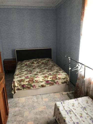 Кровать или кровати в номере Holiday home on Bestuzhego Marlinskogo 3