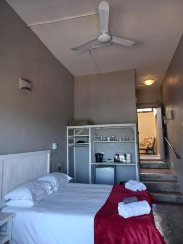 a bedroom with a bed with two towels on it at Eagle's Crest in Worcester