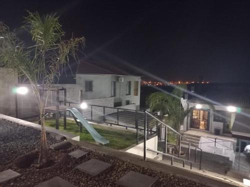 a house with a slide and a playground at night at Eagle's Crest in Worcester