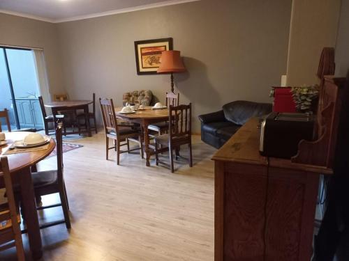 a living room with a couch and a table and chairs at Eagle's Crest in Worcester