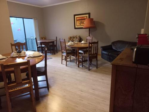 a living room with a table and chairs and a couch at Eagle's Crest in Worcester