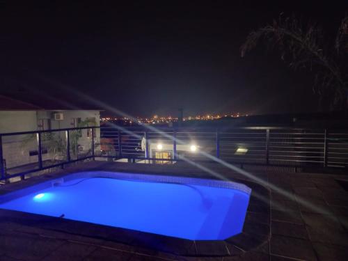 a swimming pool at night with blue lights at Eagle's Crest in Worcester